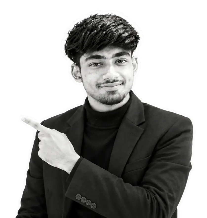 Rimon Babu pointing to the side wearing suit on dark background